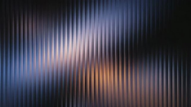 Abstract background with vertical ribbed texture and warm light reflections motion animated video 4k