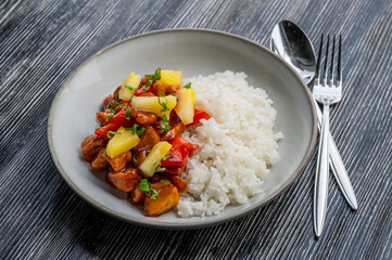 Chicken with pineapple in teriyaki sauce with fried rice. 