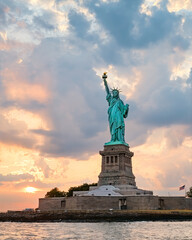 Fototapeta premium State of Liberty at sunset in from New York Harbor