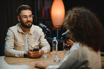 Content creators recording podcast in modern studio