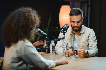 Content creators recording podcast in modern studio