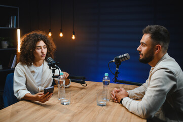 Content creators recording podcast in professional studio