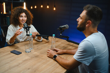 Podcasters discussing during recording podcast session