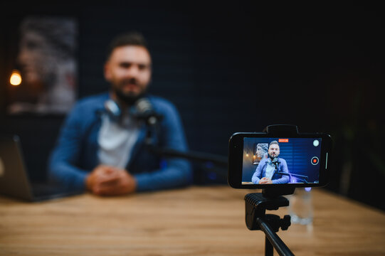 Content creator recording video blog in home studio - Powered by Adobe