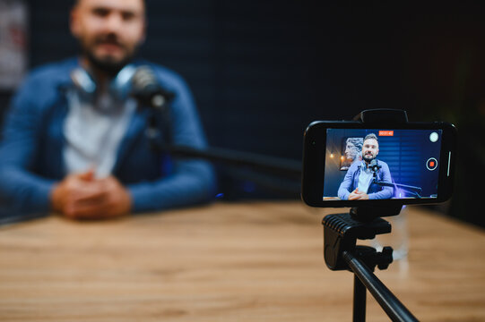 Content creator recording video blog in home studio