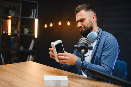 Influencer unboxing new smartphone for tech review video blog