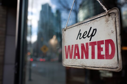 Help Wanted Sign on Storefront for Job Openings