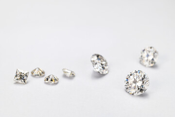 A row of diamonds are displayed on a white background