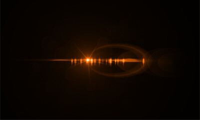 Golden lens flare effect on black background for photography and graphic design projects use