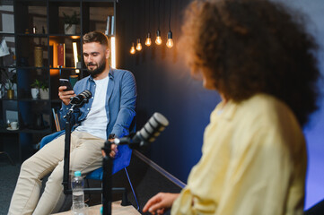 Content creators recording podcast in modern studio