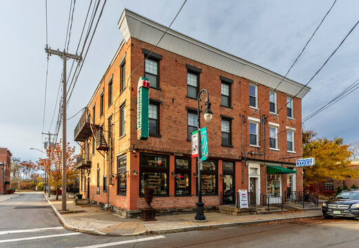 Schenectady, NY - US - Nov 15, 2025 A brick corner building in Schenectady&rsquo;s Little Italy hosts caf&eacute;s and bakeries, its warm storefronts, fall colors, and vintage charm brightening the neighborhood.