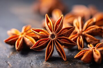 Fototapeta premium Close-up of star anise spice on dark surface
