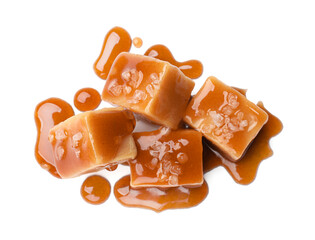 Tasty candies with salt and caramel sauce isolated on white, top view