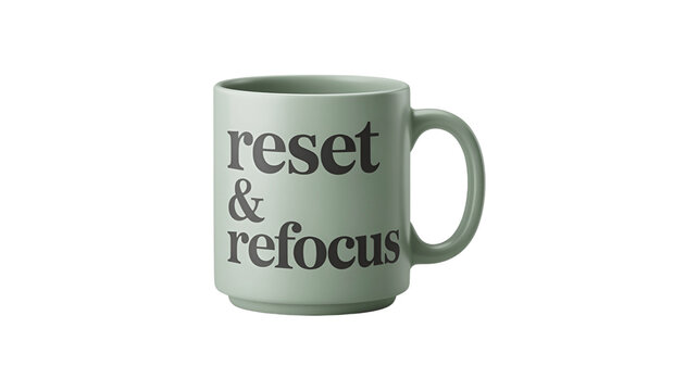 A green mug with the words reset & refocus on it.