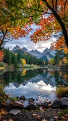 Autumn mountain and forest landscape with trees, sky, and reflection in a blue water lake