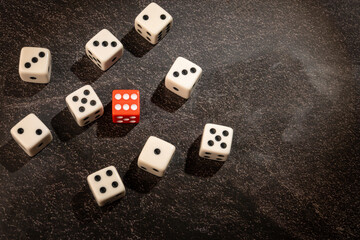 Dice thrown randomly onto a dark surface and dark background, Selective Focus.