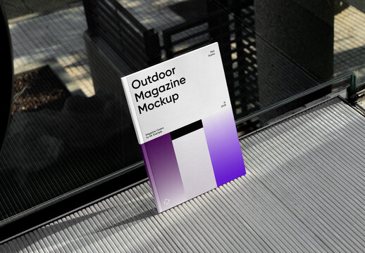 Leans Against The Glass Magazine Mockup