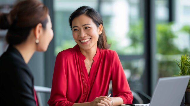 Office mentor with supervisor coaching faceless intern Asian workplace business task guidance professional development corporate training modern office setting employee