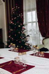 Preparing for the New Year. Decorating the table and Christmas tree at home