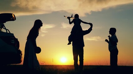 Parents children daughters have fun sunset. Happy family travels by car. Big family, Travel by car. Mom dad children stopped at campsite by car. Mother father play with children ball toy airplane. Kid