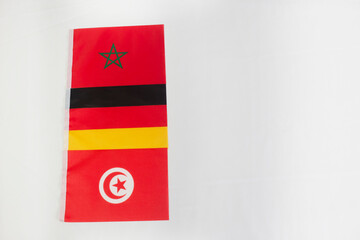 Morocco, Germany and Tunisia flags in white background with copy space