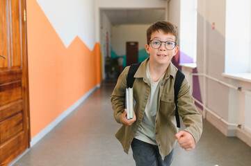 Elementary school student running in school hallway