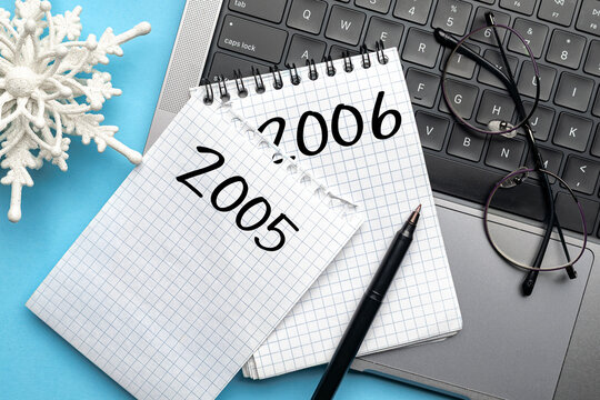 Planning new year goals notebook on laptop