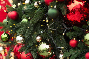 cozy New Year's toys Christmas ball against a Christmas tree. Merry Christmas and Happy New Year