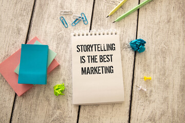 Storytelling is the best marketing words written on torn yellow paper with red background.