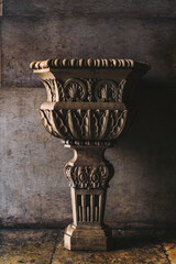 Antique ornamental stone vase in classical architectural style