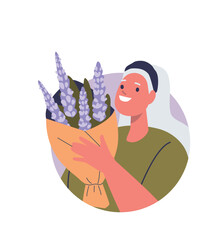 Elderly woman holding floral blooms