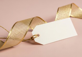 Elegant blank gift tag with shimmering gold ribbon for personalized message on pastel background
