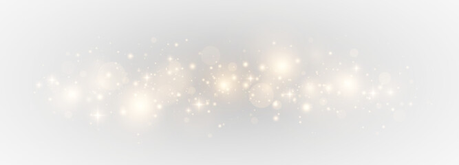 Magic luminous bokeh with sparkling particles. Festive abstract scene with glowing stardust and shimmering lights.