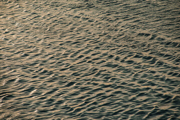 blue background of the water surface, ripples on the water, small waves