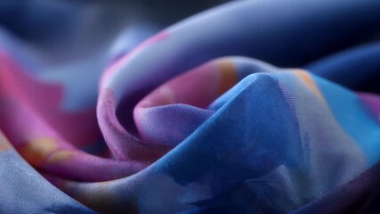 Medium shot of fabric wide format banner with soft texture and rich colors emphasizing elegant branding in outdoor promotional setup.