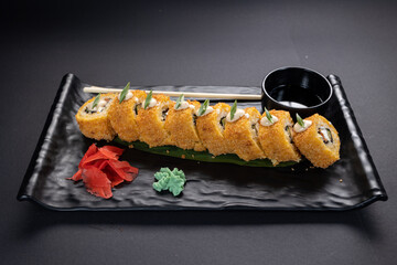 Japanese rolls, fish, black background