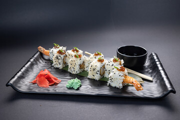 Japanese rolls, fish, black background