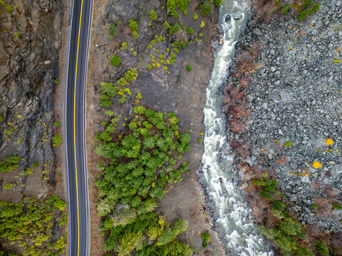 Aerial View Of Winding Mountain Road, River Canyon, And Forest In BC, Canada