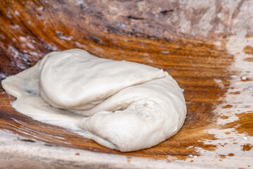 Poi or popoi is a traditional staple food in the Polynesian diet, made from taro.  Waiahole Poi Factory, Honolulu, Oahu, Hawaii. pounding taro / hand pound poi.