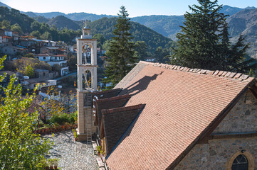 Church tower overlooking Platanistasa village in Troodos mountains, Cyprus