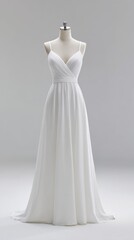 Elegant White Dress on Mannequin in Studio Setting