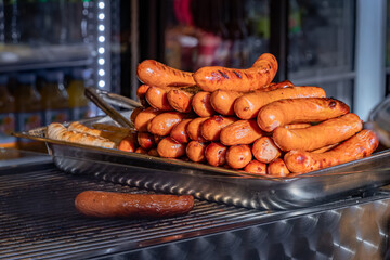 Golden brown sausages on a grill at the Christmas Market in Strasbourg, France