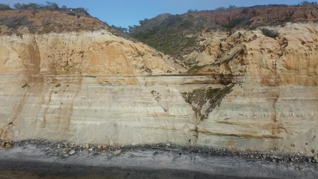 Aerial Drone View of Torrey Pines Coastline at Sunrise, Foggy Morning with Foamy Ocean Waves