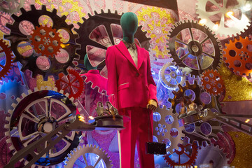 Female mannequin in an elegant suit in a showcase of original design