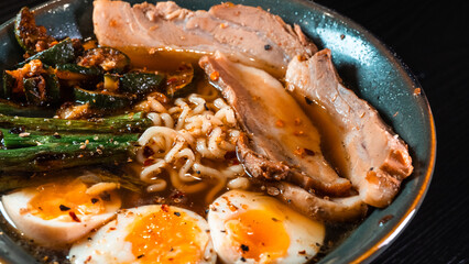 Delicious pork belly ramen with fresh asparagus, zucchini, and Nissin noodles. Rich broth, perfect comfort food. Quick and flavorful meal for Asian cuisine lovers.