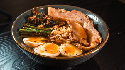 Delicious pork belly ramen with fresh asparagus, zucchini, and Nissin noodles. Rich broth, perfect comfort food. Quick and flavorful meal for Asian cuisine lovers.