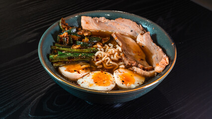 Delicious pork belly ramen with fresh asparagus, zucchini, and Nissin noodles. Rich broth, perfect comfort food. Quick and flavorful meal for Asian cuisine lovers.