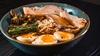 Delicious pork belly ramen with fresh asparagus, zucchini, and Nissin noodles. Rich broth, perfect comfort food. Quick and flavorful meal for Asian cuisine lovers.
