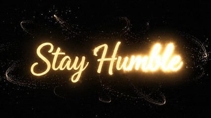 Golden particles reveal inspiring quote on black background stay humble