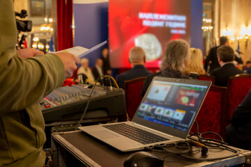 Event technician managing audio and video production